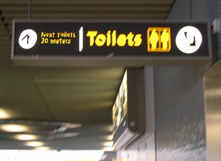 Schiphol - Next Toilets sign