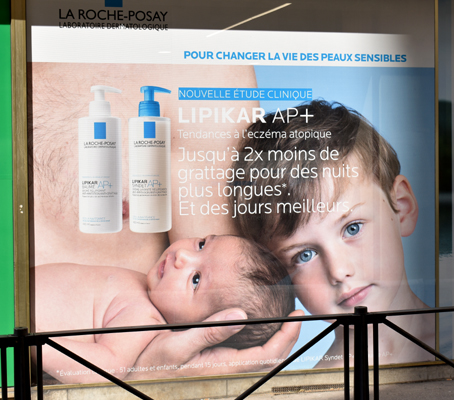skin-care ad, man holding baby, Lyon
